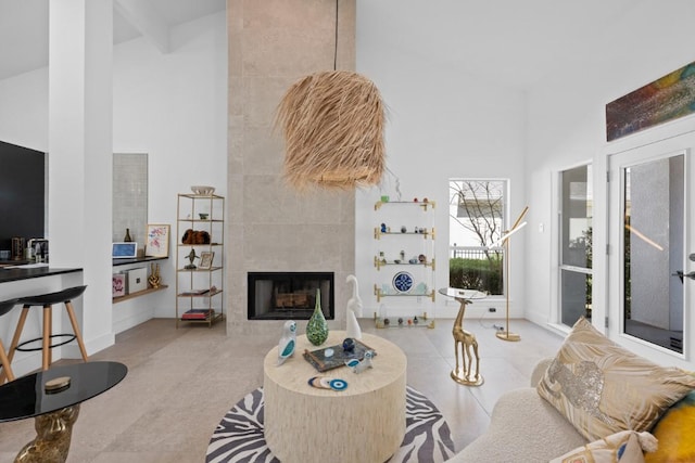 203 Golf Crest Ln, Lakeway, TX 78734 - living area featuring a towering ceiling and a fireplace