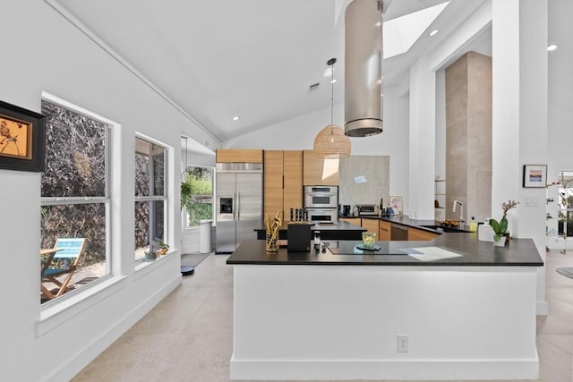 203 Golf Crest Ln, Lakeway, TX 78734 - kitchen with appliances with stainless steel finishes, dark countertops, a sink, high vaulted ceiling, and a peninsula