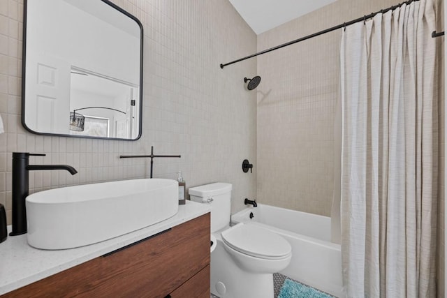 203 Golf Crest Ln, Lakeway, TX 78734 - bathroom with tile walls, toilet, shower / bath combo, and vanity
