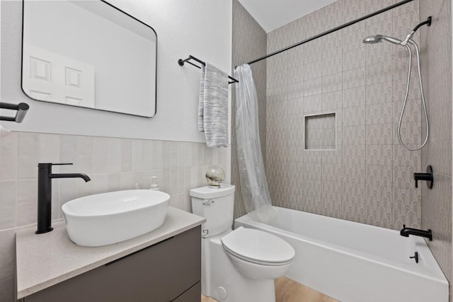 203 Golf Crest Ln, Lakeway, TX 78734 - full bathroom featuring shower / tub combo, vanity, toilet, and tile walls