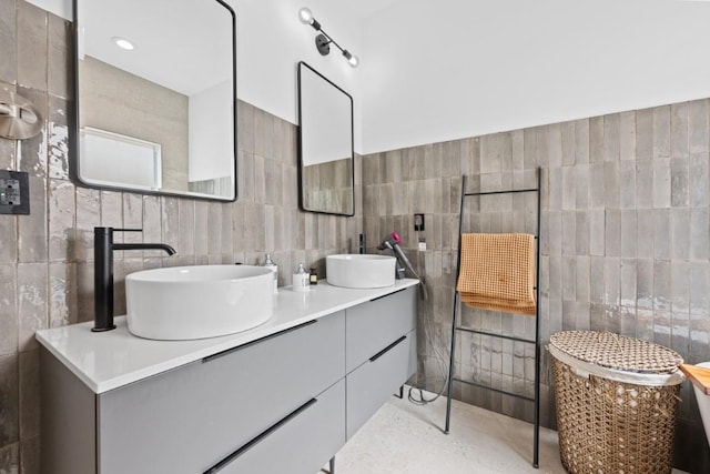 203 Golf Crest Ln, Lakeway, TX 78734 - full bathroom featuring tile walls and double vanity