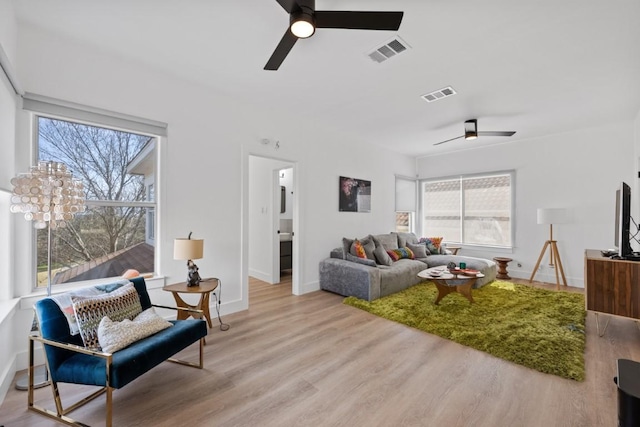 203 Golf Crest Ln, Lakeway, TX 78734 - living area featuring ceiling fan, wood finished floors, and baseboards