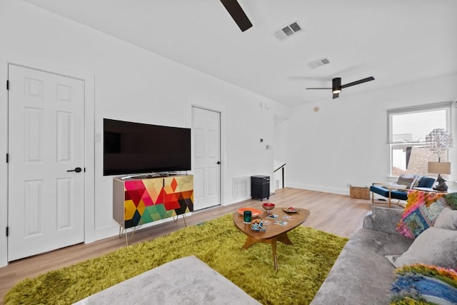 203 Golf Crest Ln, Lakeway, TX 78734 - living area featuring a ceiling fan, wood finished floors, and baseboards