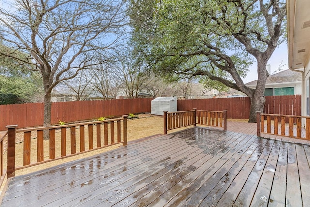10914 Sierra Oaks, Austin, TX 78759 - deck featuring a fenced backyard, a storage unit, and an outdoor structure