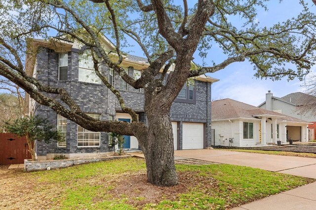 10914 Sierra Oaks, Austin, TX 78759 - traditional-style house with concrete driveway and an attached garage