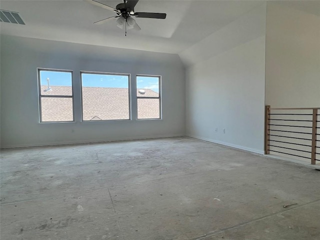interior space with vaulted ceiling, baseboards, a ceiling fan, and visible vents