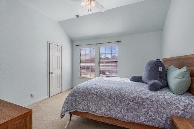 bedroom featuring light carpet, ceiling fan, baseboards, and lofted ceiling