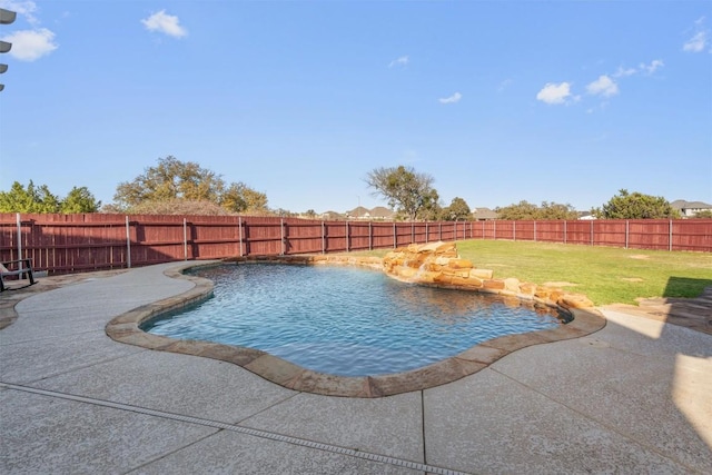 view of swimming pool with a fenced in pool, a lawn, and a fenced backyard