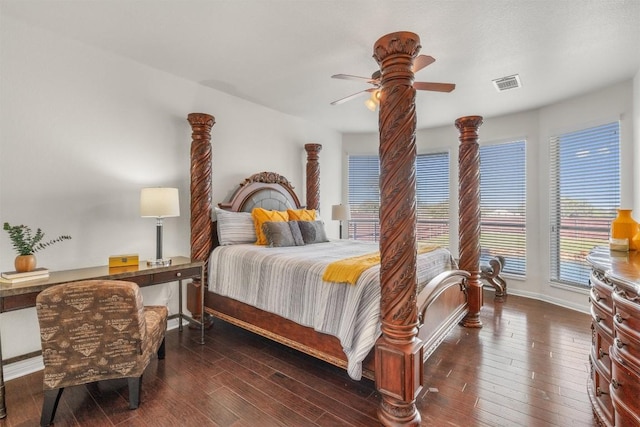 bedroom with visible vents, wood-type flooring, baseboards, and ceiling fan