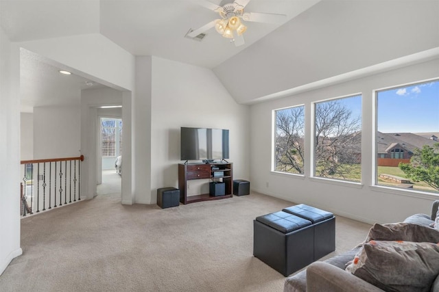 living room featuring lofted ceiling, a healthy amount of sunlight, and ceiling fan