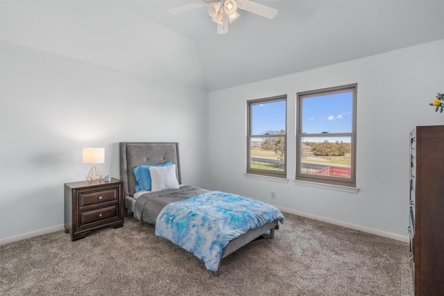 carpeted bedroom with baseboards, lofted ceiling, and a ceiling fan