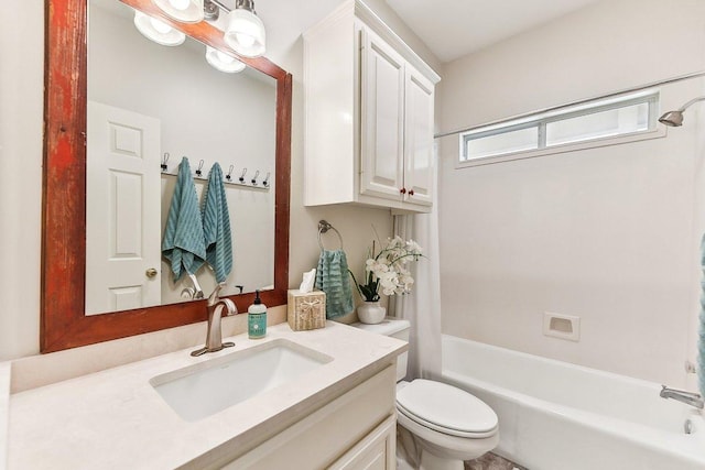 full bathroom featuring toilet, vanity, and bathing tub / shower combination