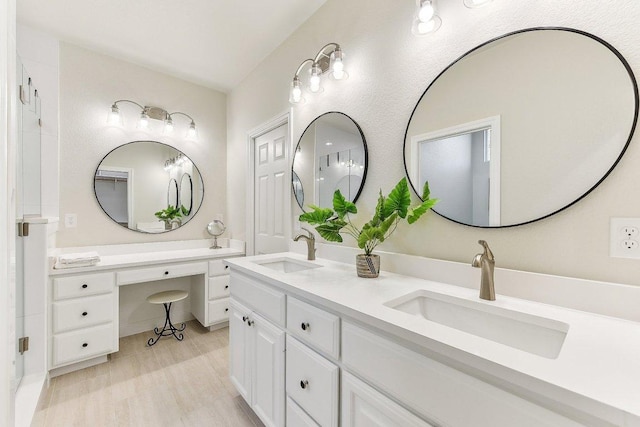 bathroom with a sink and double vanity