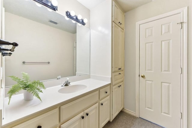 bathroom with visible vents and vanity