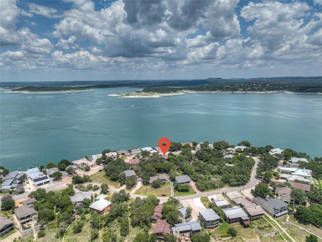 drone / aerial view featuring a residential view and a water view