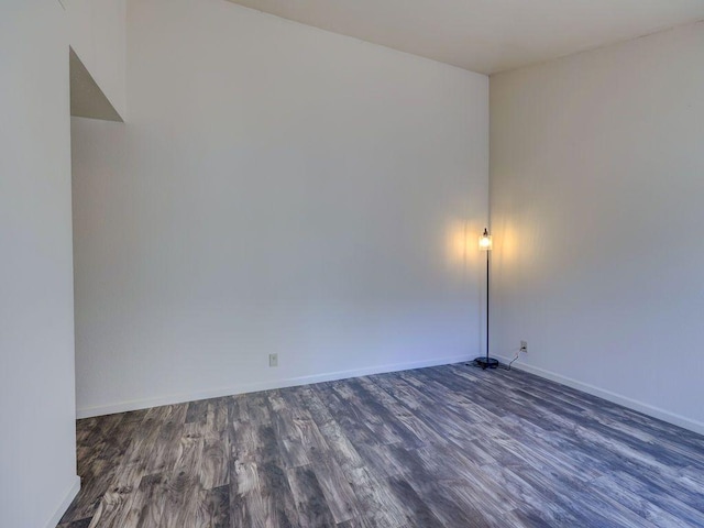 6905 Old Post Loop, Austin, TX 78744 - empty room with dark wood finished floors and baseboards