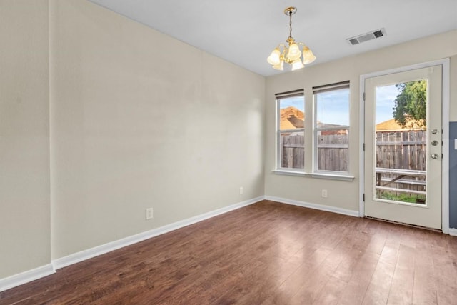 3609 Mims Cv, Austin, TX 78725 - unfurnished room featuring a chandelier and wood finished floors