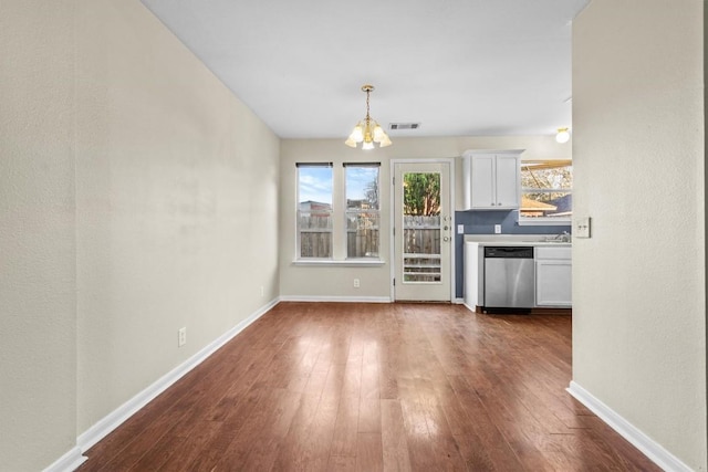 3609 Mims Cv, Austin, TX 78725 - unfurnished living room with a chandelier and dark wood-type flooring
