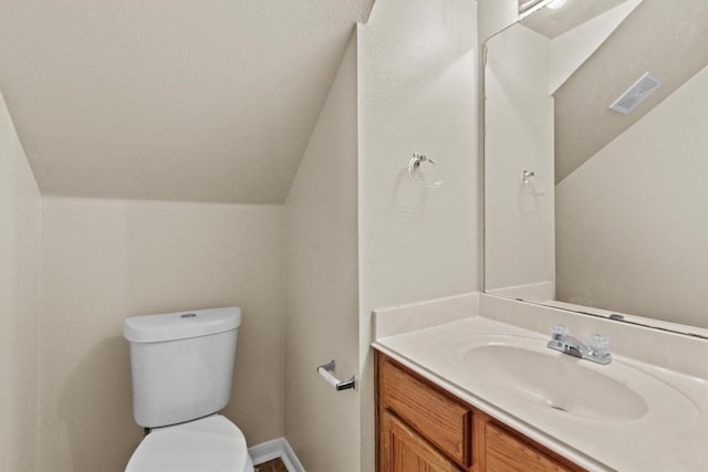 3609 Mims Cv, Austin, TX 78725 - half bathroom featuring vanity and lofted ceiling