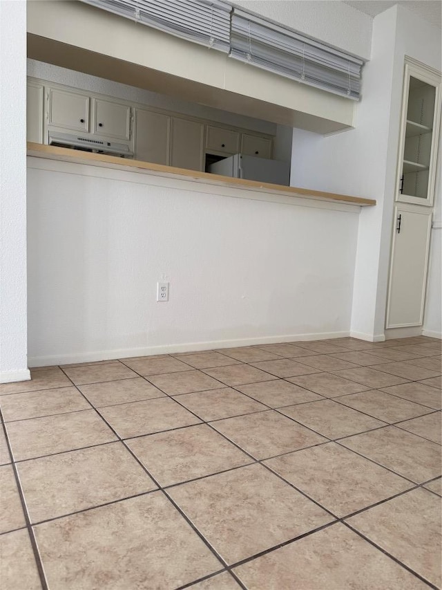 10616 Mellow Meadows Dr Unit 30-D, Austin, TX 78750 - kitchen featuring gray cabinetry and light tile patterned floors