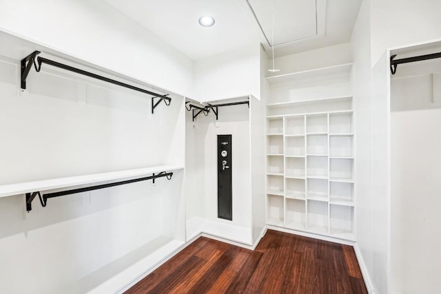 405 Rio, Horseshoe Bay, TX 78657 - walk in closet with dark wood-style floors and attic access