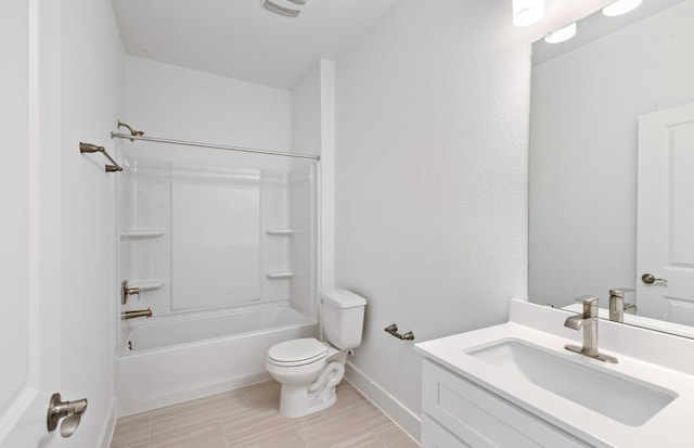 585 Tailwind Dr, Kyle, TX 78640 - bathroom with toilet, vanity, baseboards, wood tiled floors, and shower / bathtub combination