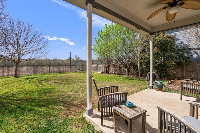 view of yard with a patio, a fenced backyard, and ceiling fan