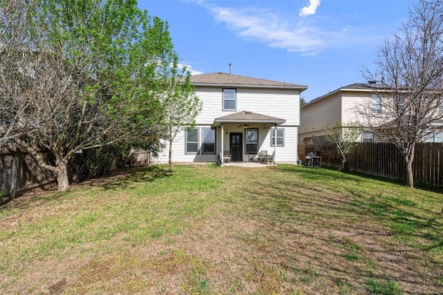 back of house with a patio area, a fenced backyard, and a lawn