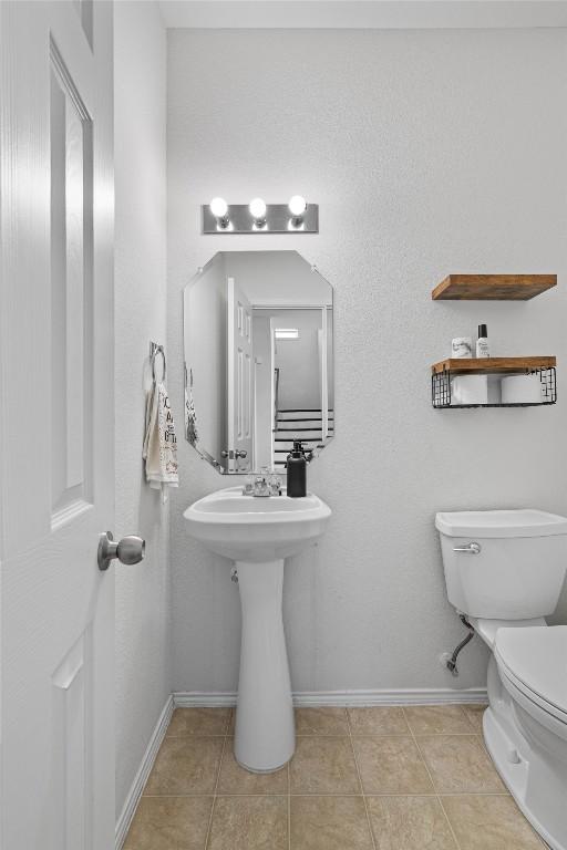 18037 Basket Flower Bnd, Elgin, TX 78621 - half bathroom with toilet and tile patterned floors