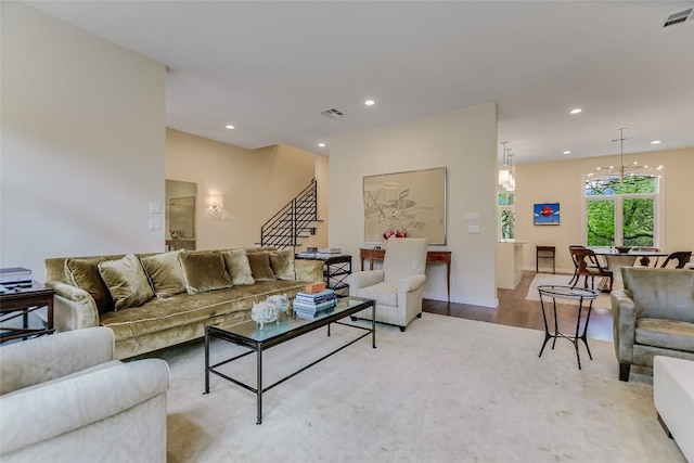 living area with visible vents, recessed lighting, stairway, and light wood-type flooring