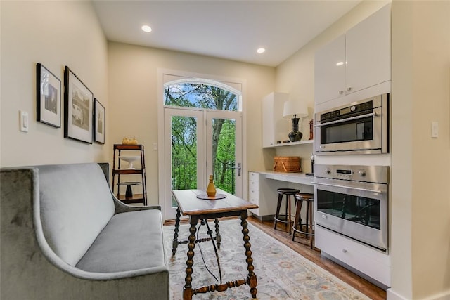 living area featuring recessed lighting and wood finished floors