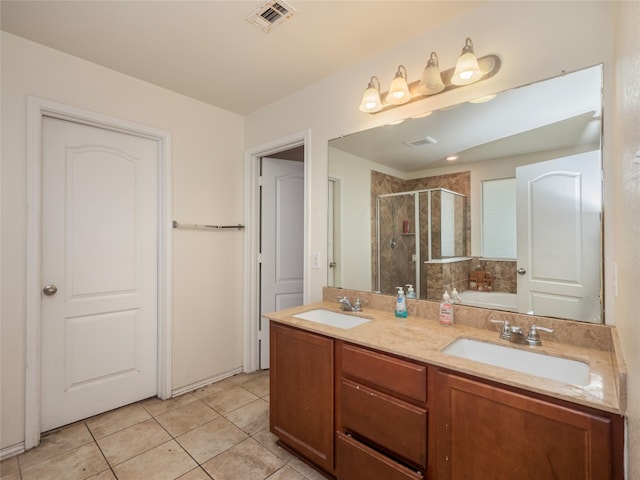 670 Landon Samuel Loop, Pflugerville, TX 78660 - bathroom featuring a shower stall, double vanity, a garden tub, and tile patterned floors