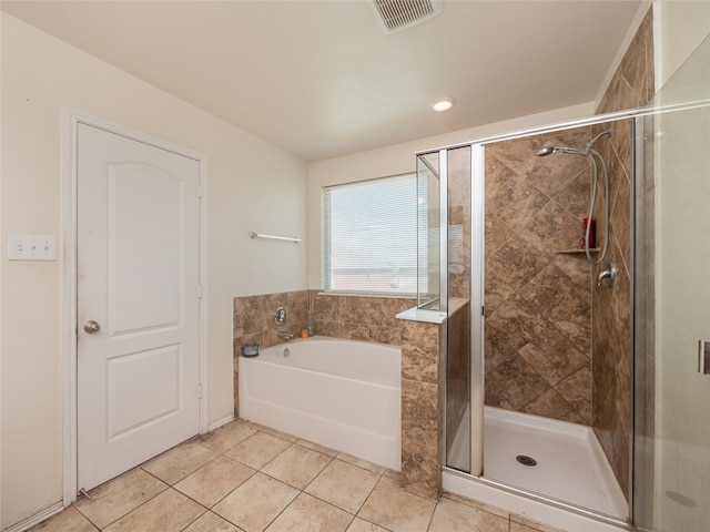 670 Landon Samuel Loop, Pflugerville, TX 78660 - bathroom with a garden tub, a shower stall, tile patterned flooring, and recessed lighting