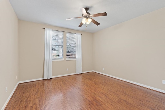 4706 Madrid Dr, Georgetown, TX 78628 - empty room featuring ceiling fan, wood finished floors, and baseboards