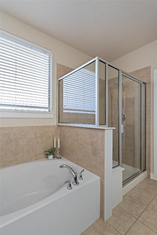 4706 Madrid Dr, Georgetown, TX 78628 - full bathroom with a bath, a shower stall, and tile patterned flooring