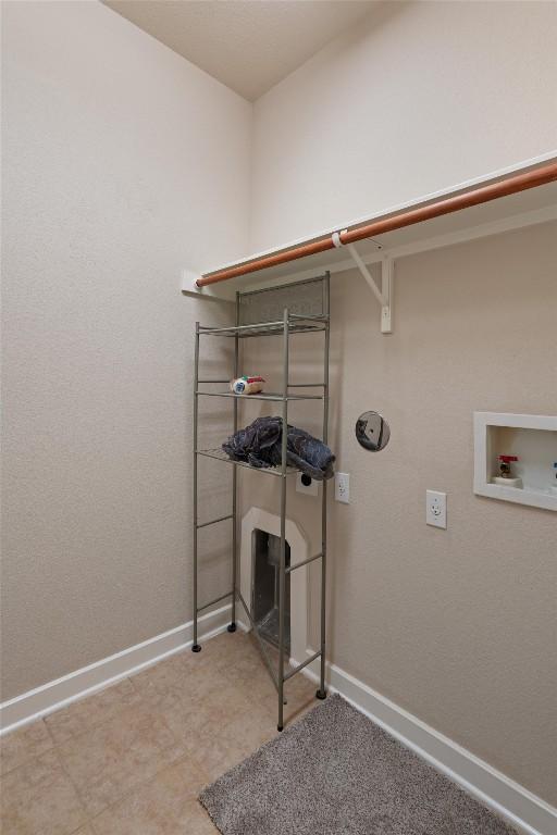 4706 Madrid Dr, Georgetown, TX 78628 - washroom featuring baseboards and washer hookup