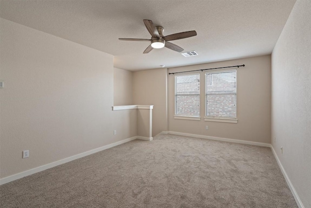 4706 Madrid Dr, Georgetown, TX 78628 - spare room featuring a ceiling fan, carpet flooring, a textured ceiling, and baseboards