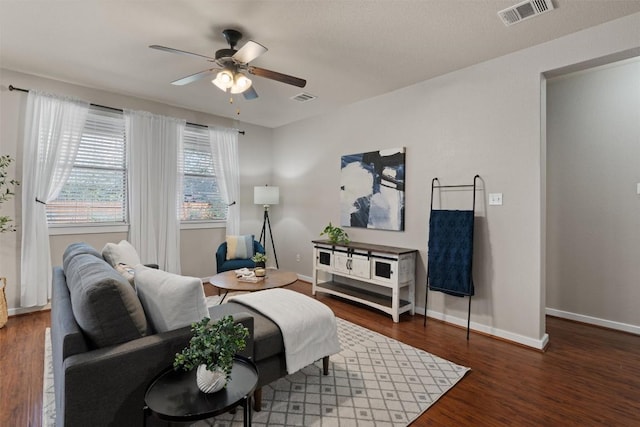 4706 Madrid Dr, Georgetown, TX 78628 - living room with a ceiling fan, wood finished floors, and baseboards