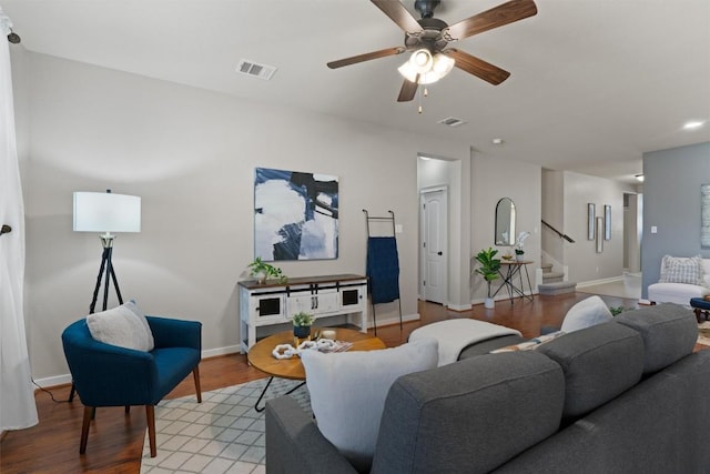 4706 Madrid Dr, Georgetown, TX 78628 - living room with stairway, light wood-style flooring, a ceiling fan, and baseboards