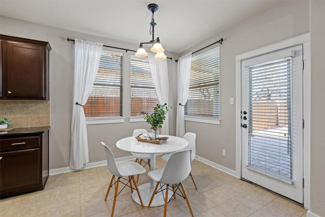 4706 Madrid Dr, Georgetown, TX 78628 - dining room with baseboards and light tile patterned floors