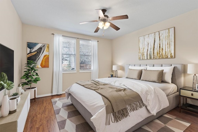 4706 Madrid Dr, Georgetown, TX 78628 - bedroom featuring wood finished floors, baseboards, and ceiling fan