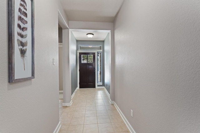 4706 Madrid Dr, Georgetown, TX 78628 - corridor featuring light tile patterned flooring and baseboards