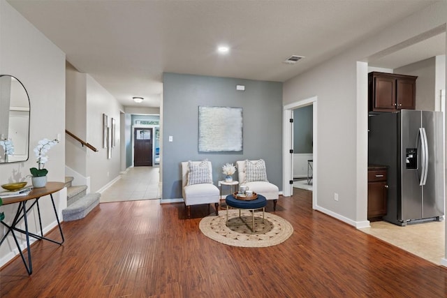 4706 Madrid Dr, Georgetown, TX 78628 - sitting room featuring stairs, light wood finished floors, baseboards, and recessed lighting
