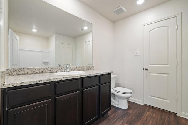 1492 Amy Dr, Kyle, TX 78640 - bathroom with vanity, wood finished floors, and recessed lighting