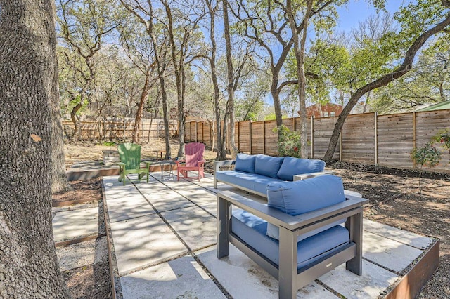 view of patio with an outdoor hangout area and a fenced backyard