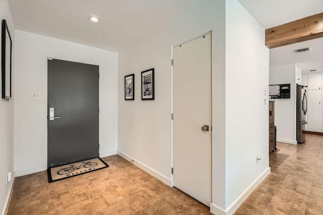 entryway featuring visible vents and baseboards