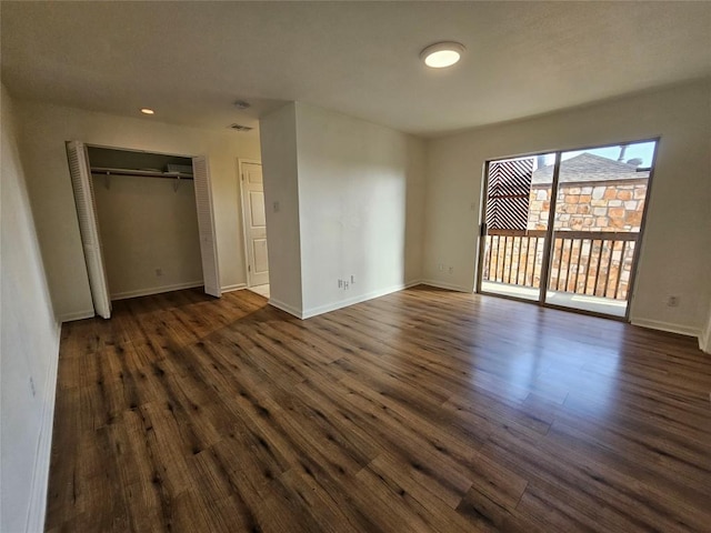 6903 Deatonhill Dr Unit 2, Austin, TX 78745 - unfurnished bedroom with access to exterior, dark wood finished floors, a closet, and recessed lighting