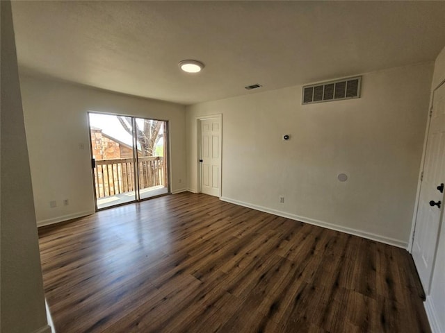 6903 Deatonhill Dr Unit 2, Austin, TX 78745 - unfurnished room with dark wood-type flooring and baseboards
