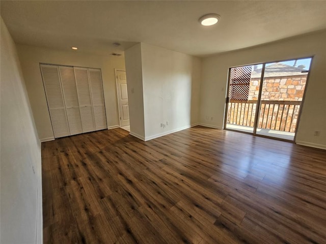 6903 Deatonhill Dr Unit 2, Austin, TX 78745 - unfurnished bedroom with access to outside, dark wood-style floors, and a closet