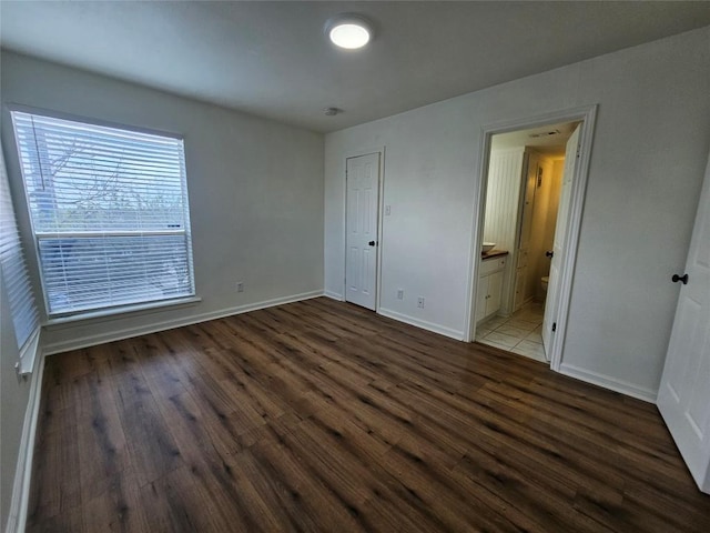 6903 Deatonhill Dr Unit 2, Austin, TX 78745 - unfurnished bedroom featuring wood finished floors and ensuite bath